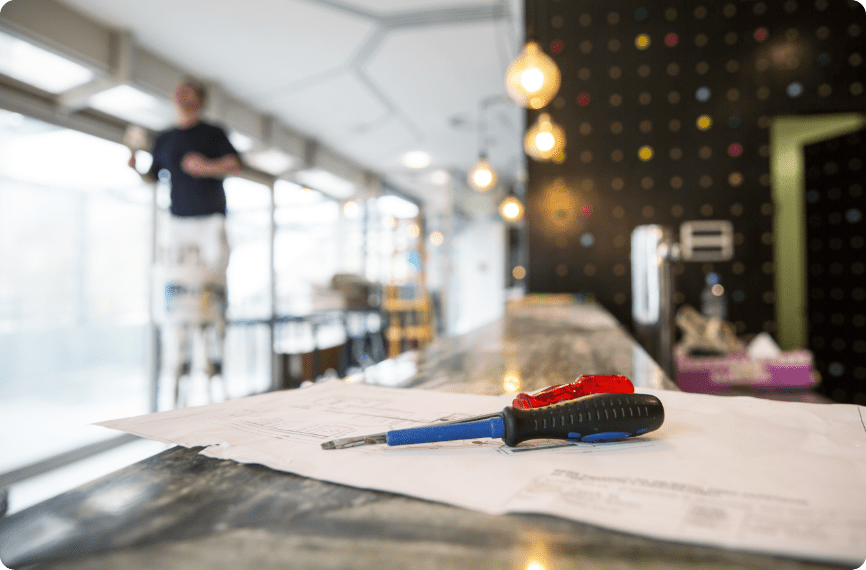 A screwdriver is placed on the floor plan map