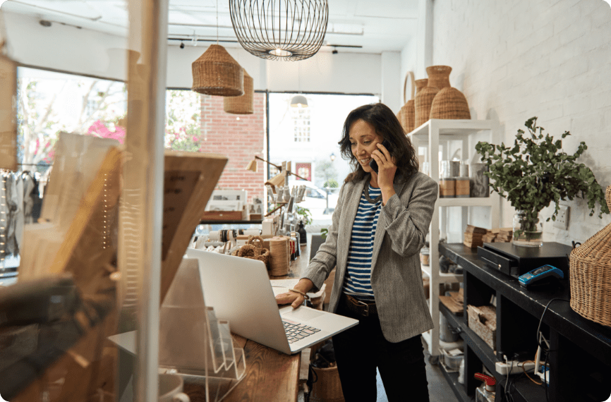 Woman working while making a phone call