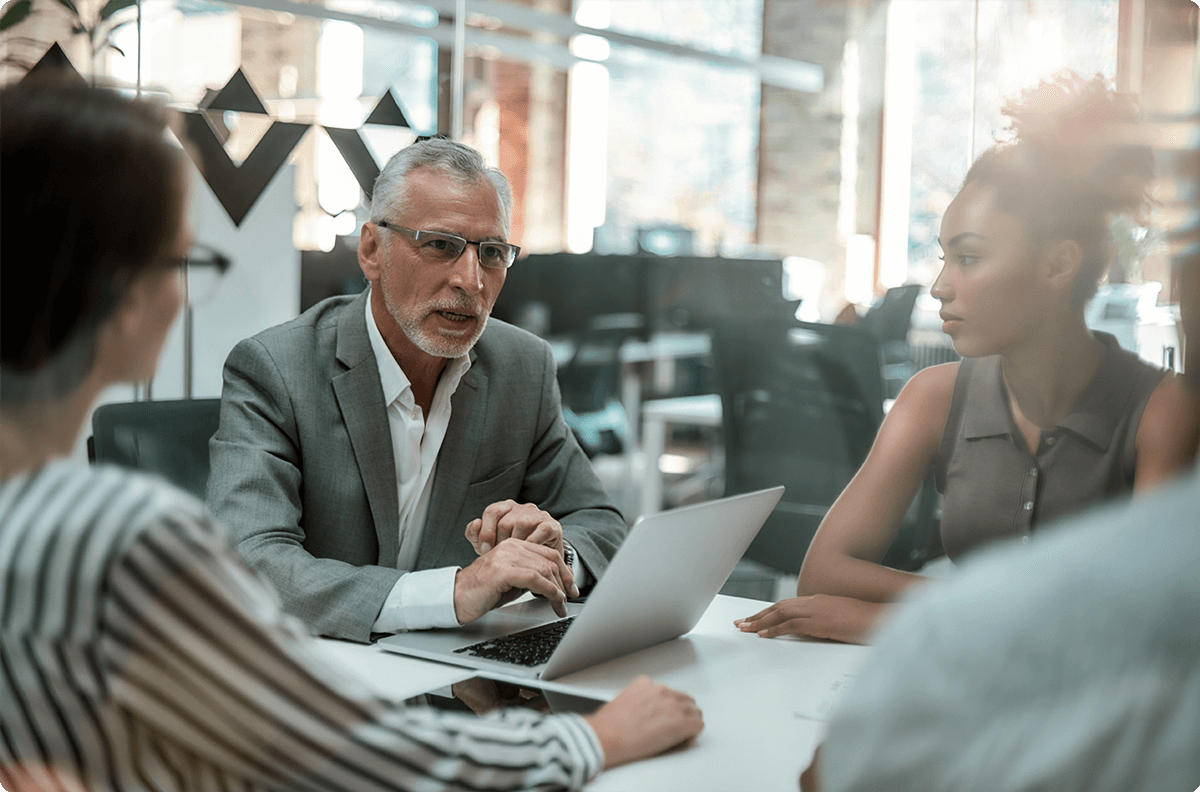 Four people in a meeting